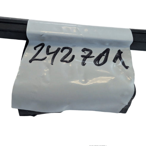 White plastic strip with black text '242701' on a white background